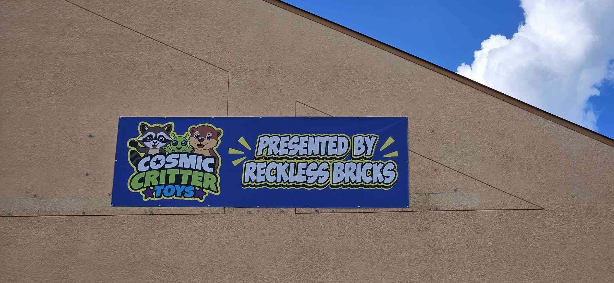 Cosmic Critter Toys banner on Clark Road — Presented by Reckless Bricks